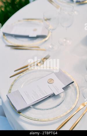 Name card lies on the menu on a plate on the festive table Stock Photo