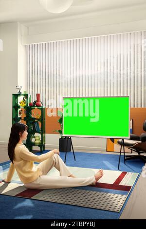 People are watching and enjoying next to the TV, monitor with green screen Stock Photo