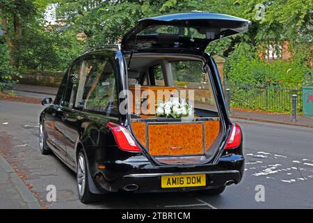 Coffin being Transported in A Hearse for A Greek Orthodox Funeral Glasgow Scotland Stock Photo