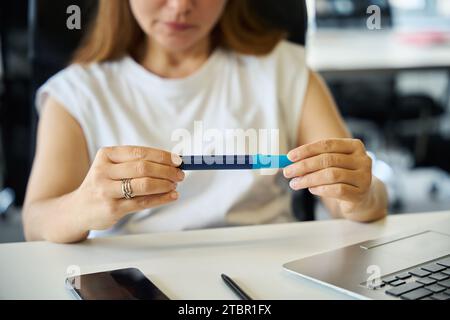 Young employee holds special syringe with medicine in her hands Stock Photo