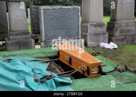 Glasgow Scotland Greek Orthodox Funeral at Glasgow Necropolis - Coffin Sitting Above Grave Ready to be Lowered Stock Photo