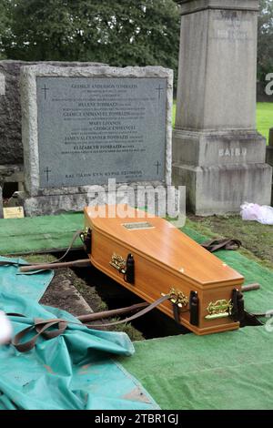 Glasgow Scotland Greek Orthodox Funeral at Glasgow Necropolis - Coffin Sitting Above Grave Ready to be Lowered Stock Photo