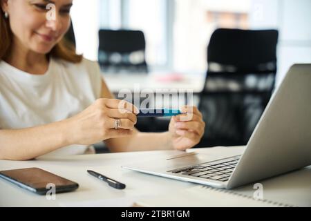 Young manager holds injection pen-syringe with medicine in her hands Stock Photo