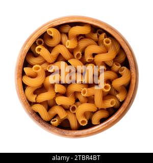 Cellentani or also cavatappi pasta in a wooden bowl. Corkscrew shaped gluten free pasta scored with lines or ridges on the surface. Stock Photo