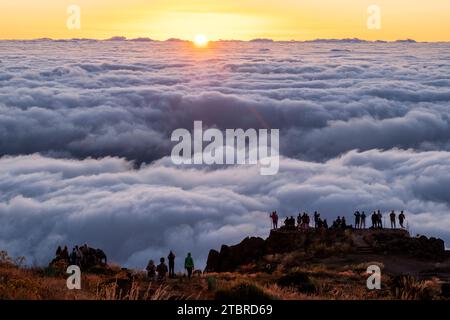 Tourists at sunrise on Pico do Arieiro, above the clouds, Madeira, Portugal, Europe Stock Photo