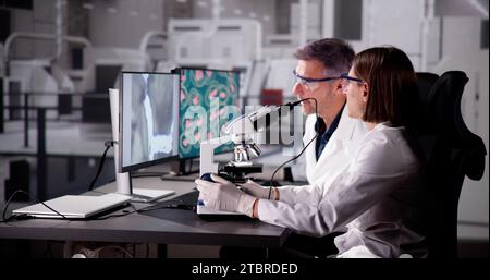 Medical Research Scientist Conducting Blood Sample Test in Lab Stock Photo