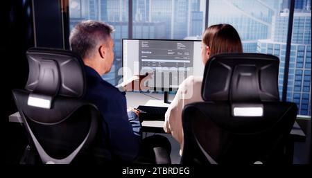 Accountant Checking Invoice for Online Payment with People Stock Photo