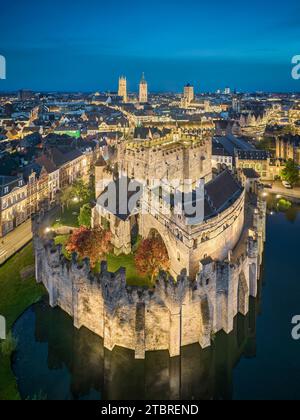 Castle Gravensteen at night with the old town in the background, Ghent, Belgium Stock Photo