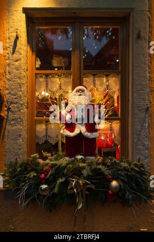 Santa Claus figure, festive decorated window Stock Photo