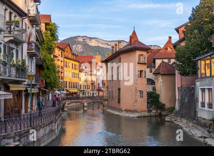 Quai de l'évêché on the Thiou river, at setting sun, and the Palais de l'Isle on the right, in Annecy, Haute-Savoie, France Stock Photo