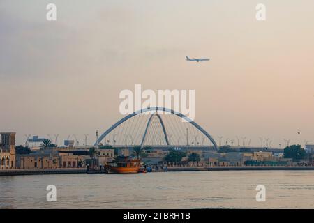 Looking across the creek from Bur Dubai towards Al Shindagha and the Infinity Bridge in Dubai, UAE. Stock Photo