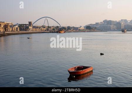 Looking across the creek from Bur Dubai towards Al Shindagha and the Infinity Bridge in Dubai, UAE. Stock Photo