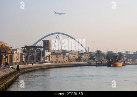 Looking across the creek from Bur Dubai towards Al Shindagha and the Infinity Bridge in Dubai, UAE. Stock Photo