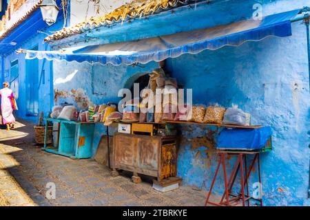Chefchaouen, Morocco. October 14th, 2022 - Nut shop in a typical old house in the medina, painted blue and with its products for sale on the street Stock Photo