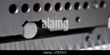 Precision Engineering Metal Peg in Hole Design Close-Up Stock Photo