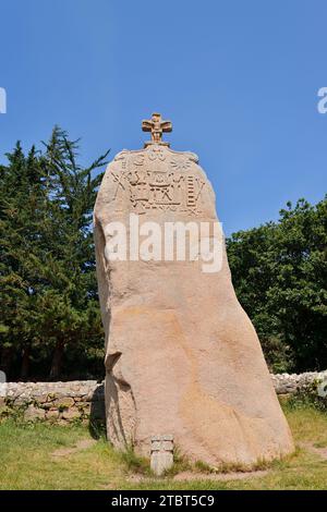 Christianized menhir of Saint-Uzec with the Arma Christi, Saint-Uzec, Cotes-d'Armor, Brittany, France Stock Photo