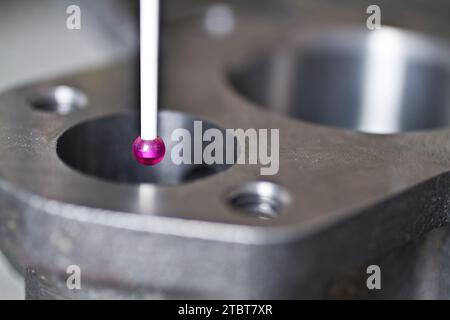 CMM Programming Precision Measurement in Industrial Setting with Magenta Probe Stock Photo