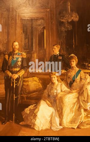 England, London, Painting of The Royal Family at Buckingham Palace showing King George V, Princess Mary, Countess of Harewood, Prince Edward, Duke of Windsor, Queen Mary by Sir John Lavery dated 1913 Stock Photo