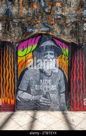 Graffiti on the grounds of Taman Festival Bali, Padang Galak, a lost place in Bali, Indonesia, a former water and amusement park that is being reclaimed by nature Stock Photo