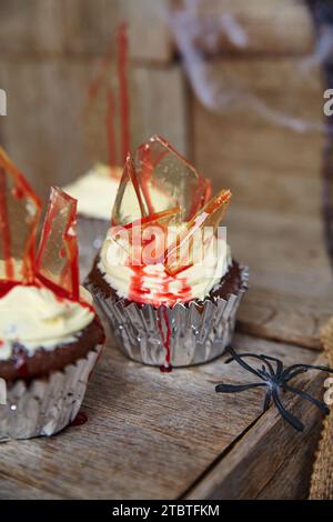 Gory Halloween Cupcakes on Rustic Wood with Spider Accent Stock Photo