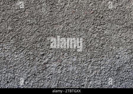 Plastered wall texture with rough relief mortar and light gray color close up Stock Photo