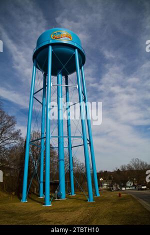 Blue Allegan Water Tower Against Dynamic Sky in Semi-Rural Community Stock Photo