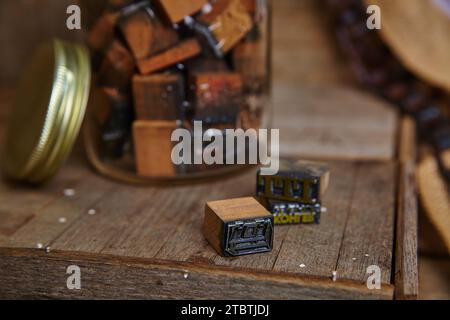 Vintage Typesetting Blocks in Rustic Setting with Warm Lighting Stock Photo