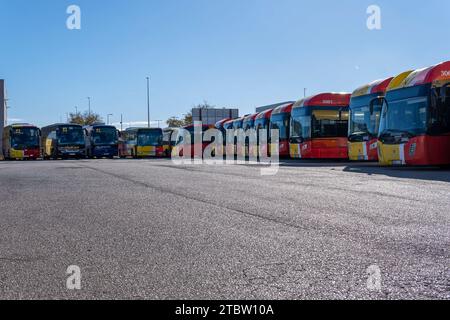 Felanitx, Spain; december 06 2023: Buses of the public company TIB, transport of the Balearic Islands, parked in an industrial park on a sunny morning Stock Photo