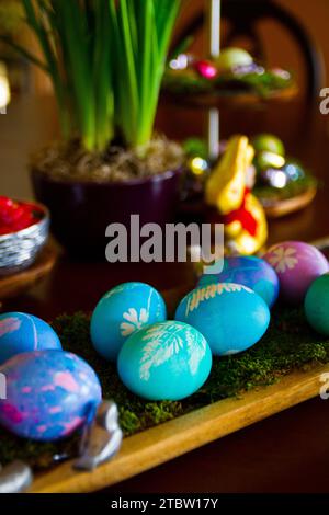 Rustic Easter Celebration with Artistic Egg Display and Spring Decorations Stock Photo