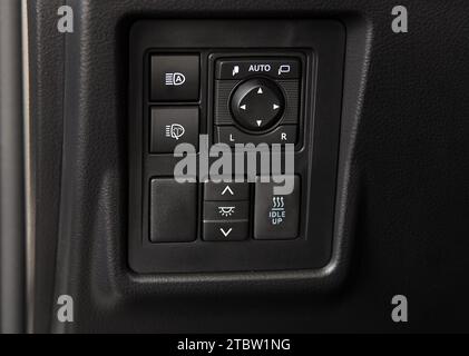 Car switch panel. Side mirror switch. Light switch. Stock Photo