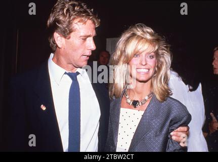 **FILE PHOTO** Ryan O'Neal Has Passed Away. Ryan O'Neal and Farrah Fawcett Circa 1980's Credit: Ralph Dominguez/MediaPunch Stock Photo