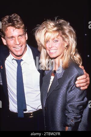 **FILE PHOTO** Ryan O'Neal Has Passed Away. Ryan O'Neal and Farrah Fawcett Circa 1980's Credit: Ralph Dominguez/MediaPunch Stock Photo