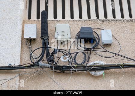 a hub box for connecting house cables to fast internet. Fiber Optical cables connected to high-speed ports. Stock Photo