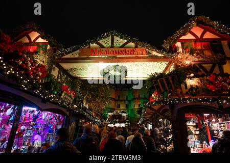 Cologne, Germany December 06 2023: entrance portal to the christmas market Nikolausdorf in the old town of cologne in the evening Stock Photo