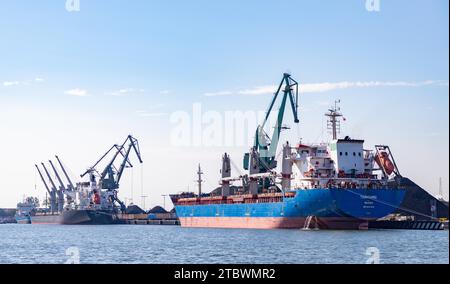 A picture of a cargo ship and a bulk carrier in the Gdansk Shipyard Stock Photo