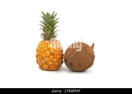 Whole pineapple fruit and coconut isolated on a white background Stock Photo