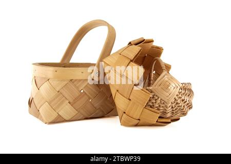 Woven wicker baskets for harvesting and storage isolated on white background Stock Photo