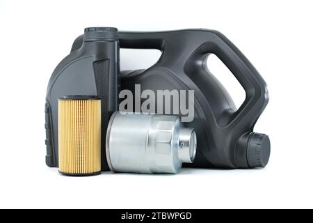 Car oil filters and motor oil cans isolated on a white background. Car servicing, automotive industry or oil and filter replacing maintenance Stock Photo