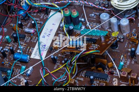 Schwerin, Germany. 28th Nov, 2023. A circuit board with electronic components in a music system from the GDR company RFT is repaired in a small workshop for old radios, record players and hi-fi systems. Small electrical appliances from East and West have been restored to working order here for around 34 years. Regular customers with a soft spot for GDR radio technology in particular hand in their devices to the trained radio and television technician. A lack of spare parts and declining interest among younger customers mean that the days of this unique work Credit: dpa/Ģ����ý Live News Stock Photo