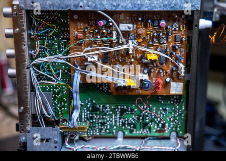Schwerin, Germany. 28th Nov, 2023. A circuit board with electronic components in a music system from the GDR company RFT is repaired in a small workshop for old radios, record players and hi-fi systems. Small electrical appliances from East and West have been restored to working order here for around 34 years. Regular customers with a soft spot for GDR radio technology in particular hand in their devices to the trained radio and television technician. A lack of spare parts and declining interest among younger customers mean that the days of this unique work Credit: dpa/Ģ����ý Live News Stock Photo