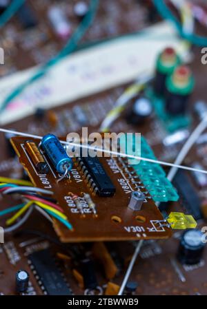 Schwerin, Germany. 28th Nov, 2023. A circuit board with electronic components in a music system from the GDR company RFT is repaired in a small workshop for old radios, record players and hi-fi systems. Small electrical appliances from East and West have been restored to working order here for around 34 years. Regular customers with a soft spot for GDR radio technology in particular hand in their devices to the trained radio and television technician. A lack of spare parts and declining interest among younger customers mean that the days of this unique work Credit: dpa/Ģ����ý Live News Stock Photo