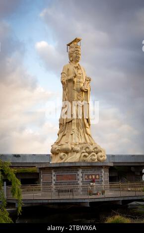 Huge statue in the Chinese temple China town Melbourne text on the statue translation is: ' ICON OF QUEEN OF HEAVEN' Stock Photo