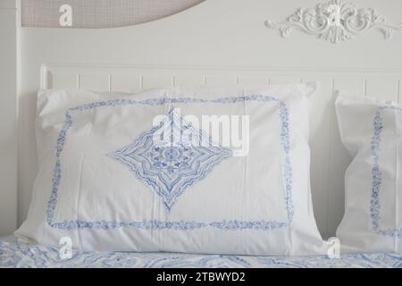 white pillow lined up on bed  Stock Photo