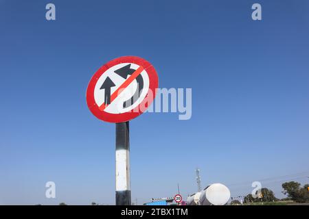 Over taking prohibited taffic sign symbol. No over taking circle with red radium signage post on highway Stock Photo