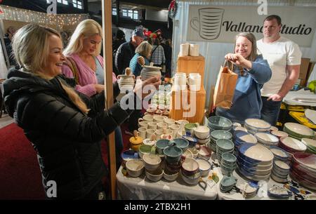 Vancouver, Canada. 8th Dec, 2023. People visit the Make It show in Vancouver, British Columbia, Canada, Dec. 8, 2023. The trade event dedicated to handmade items features exhibitors from across Canada, offering a diverse range of handmade goods. Credit: Liang Sen/Xinhua/Alamy Live News Stock Photo
