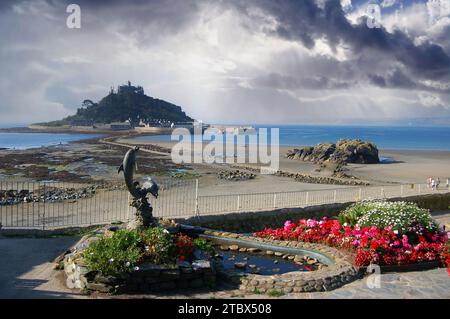 View of Mont Saint Michel in Cornwall, England, during low tide, with a spectacular partly cloudy sky. Stock Photo