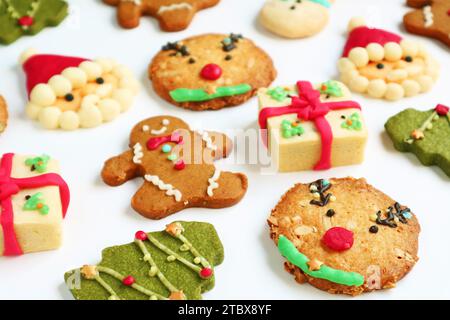 Assortment of Delectable Christmas Cookies Scattered on White Background Stock Photo