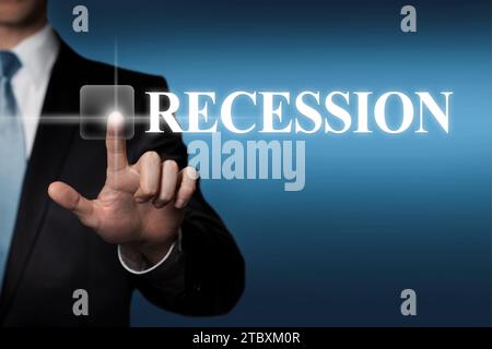 Recession - businessman pressing virtual touchscreen button Stock Photo