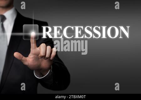 Recession - businessman pressing virtual touchscreen button Stock Photo