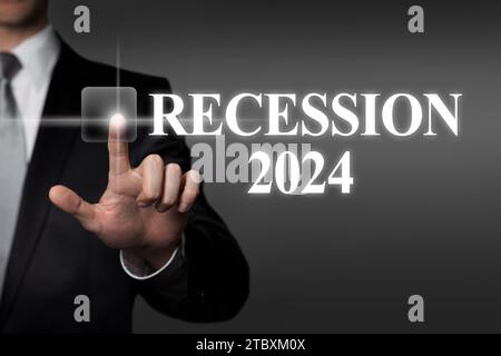 Recession 2024 - businessman pressing virtual touchscreen button Stock Photo